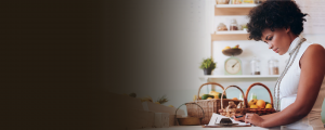 Woman planning at desk, improving business ideas